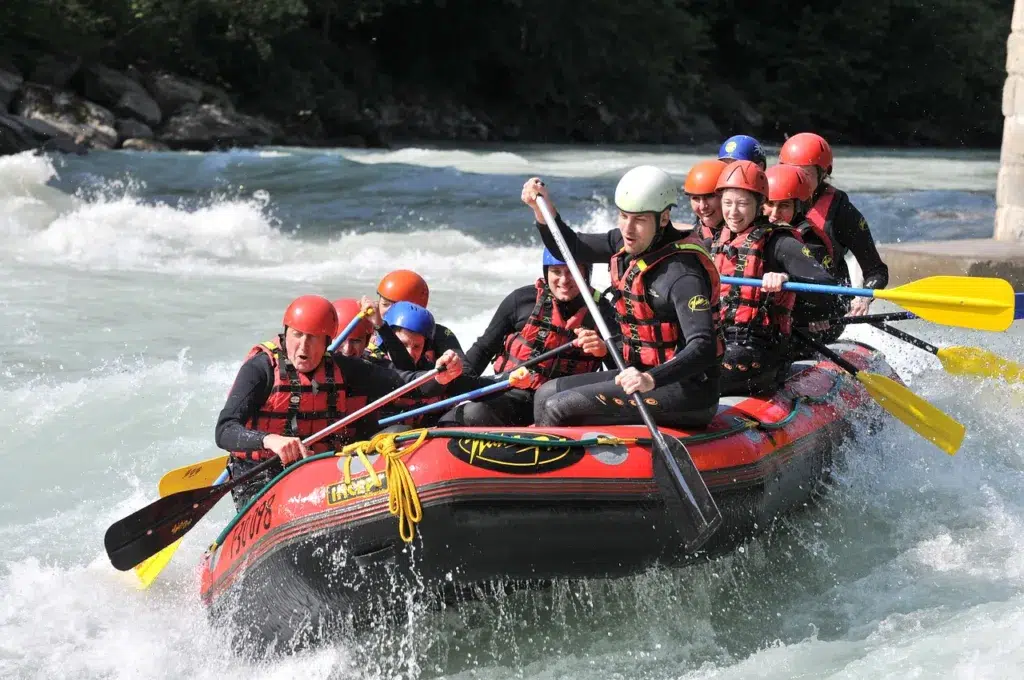 Rafting People in a raft in the water.