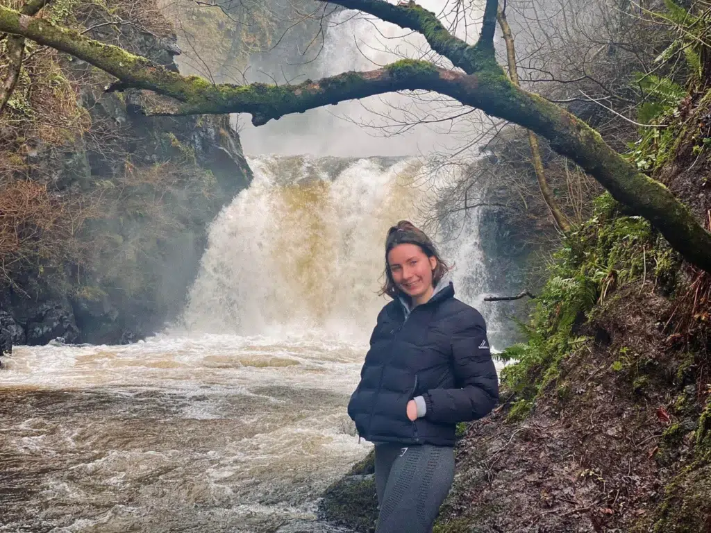 Girl standing in front of Rha Waterfalls