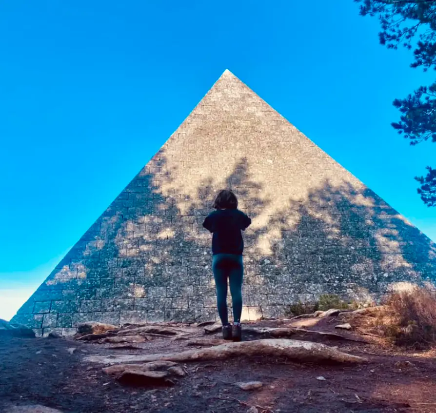 Woman in front of Prince Albert Pyramid Snow Roads