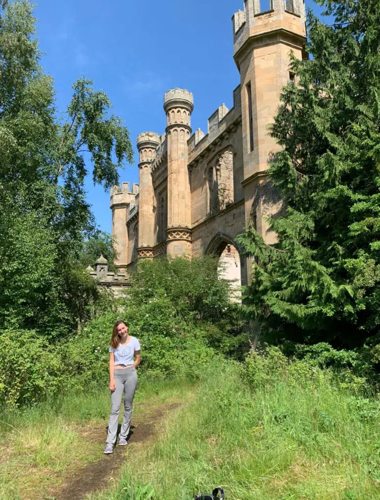 Girl stnadin in front of the abondoned Crawford Priory