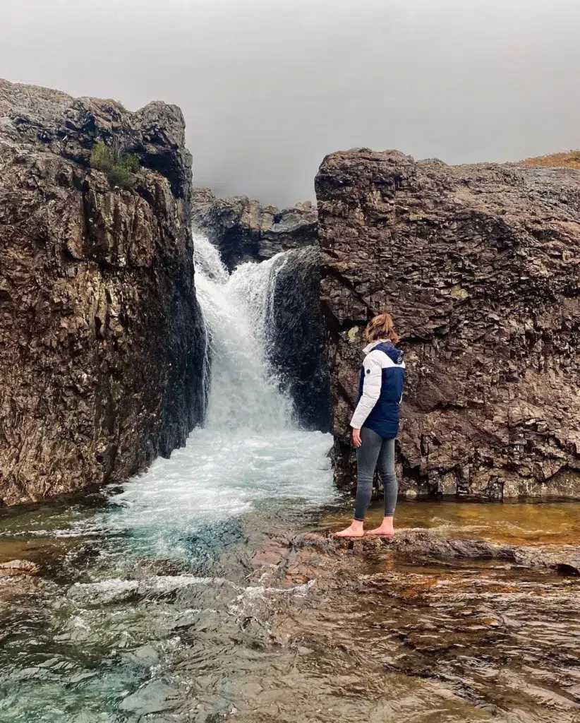 Girl standing in front of Fairy Pools