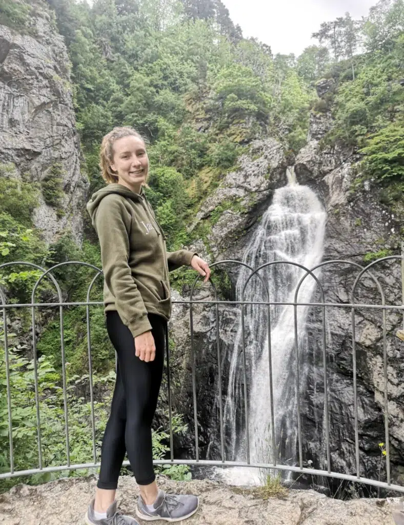 Girl standing in front of Falls of Foyers