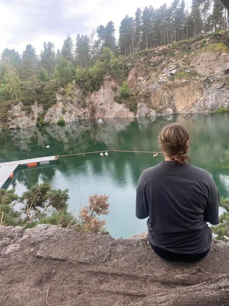 girl facing loage bowl of water Tillyfourie Quarry