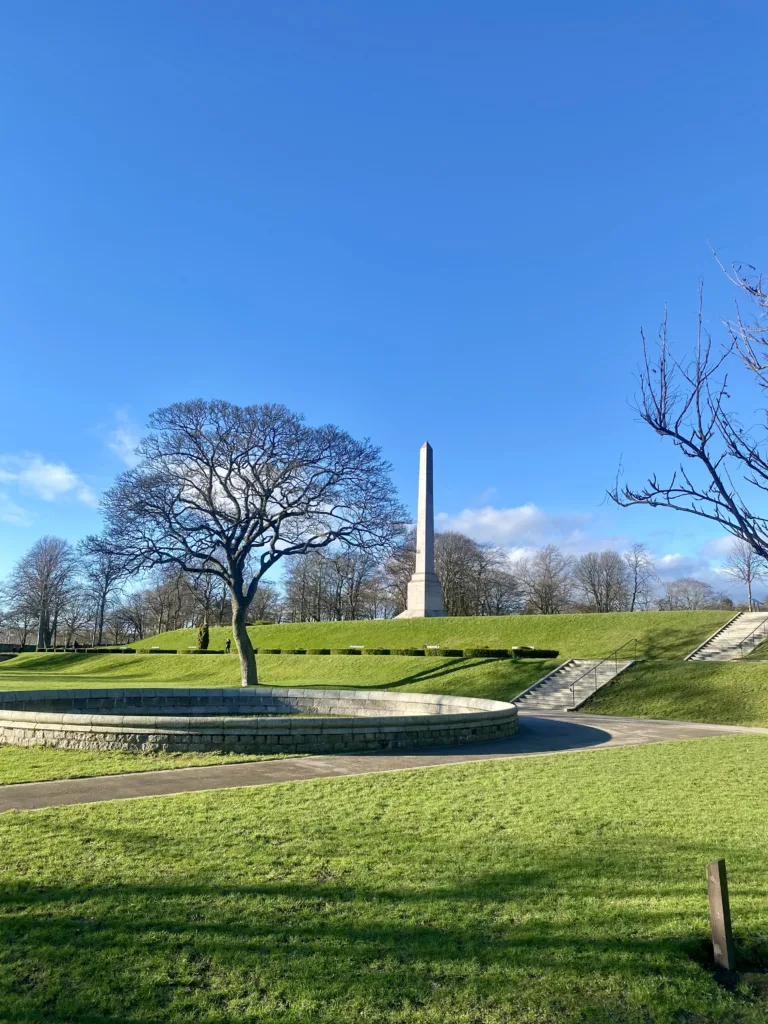 View of a tall narrow monument in Duthie Park